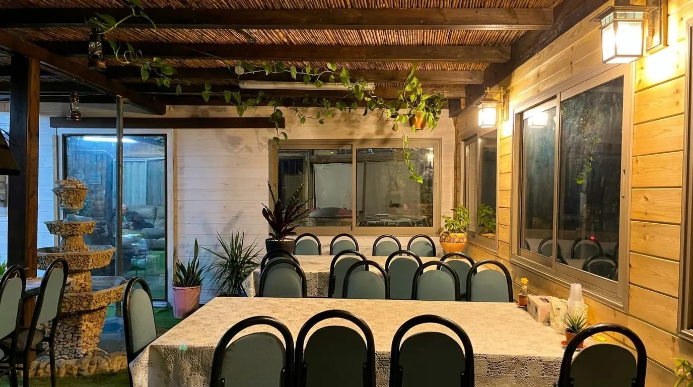 Outdoor lounge seating with fire pit at Sohela Kitchen