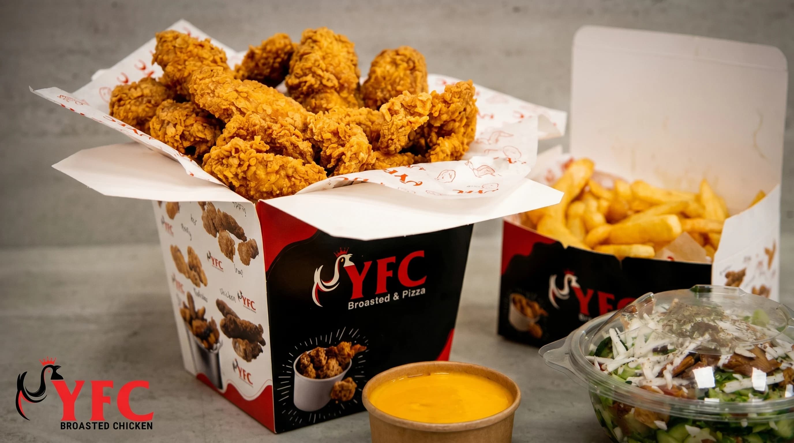 Fried chicken combo meal with fries, sauce, and salad
