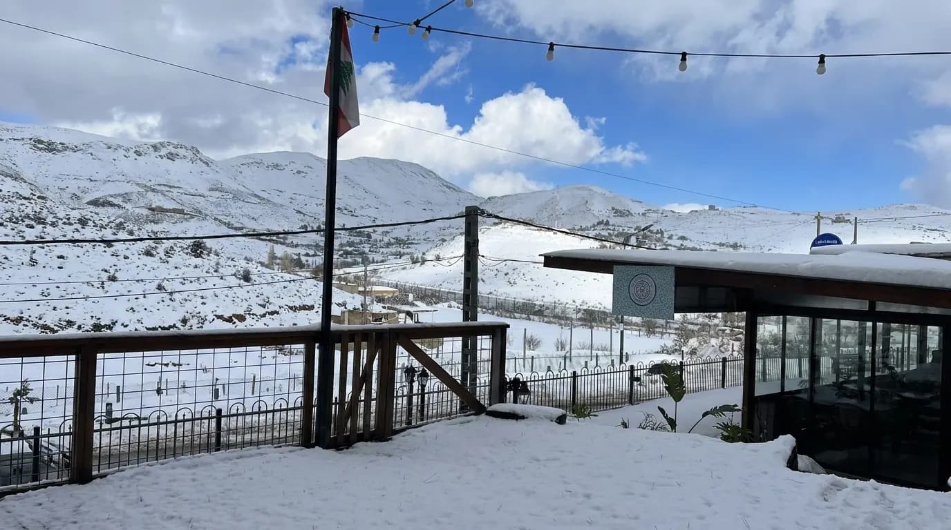 Snow-covered mountain view from the outdoor area of Bab Sharqi Restaurant